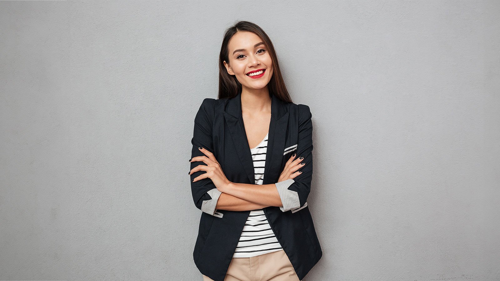 Business woman on a wall