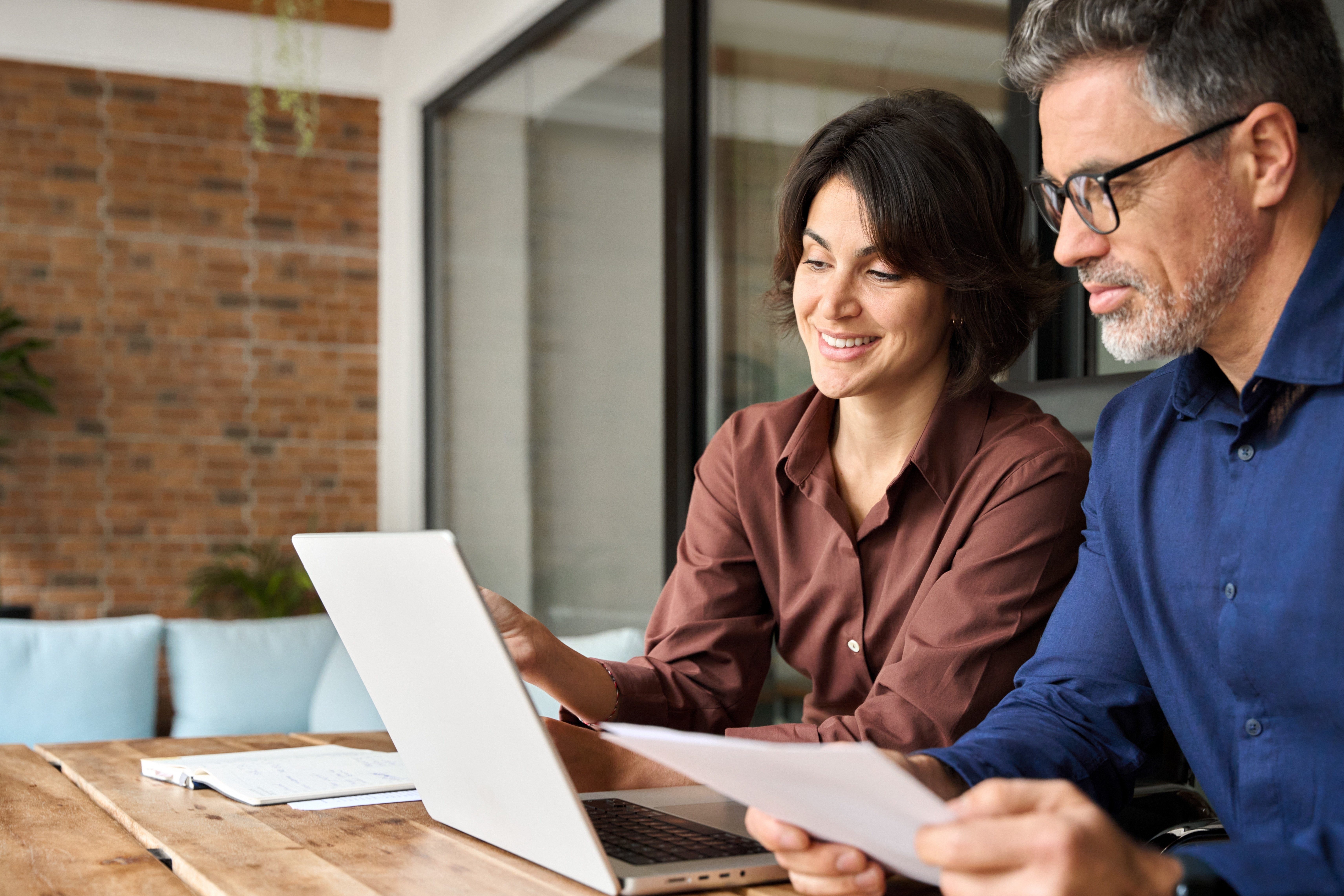 Woman and Man Working at Laptop